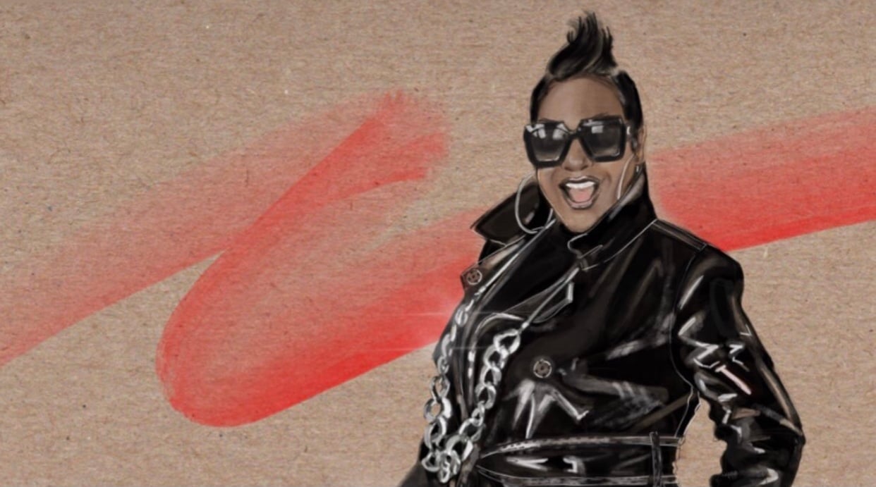 A Woman Wearing A Black Jacket And Sunglasses