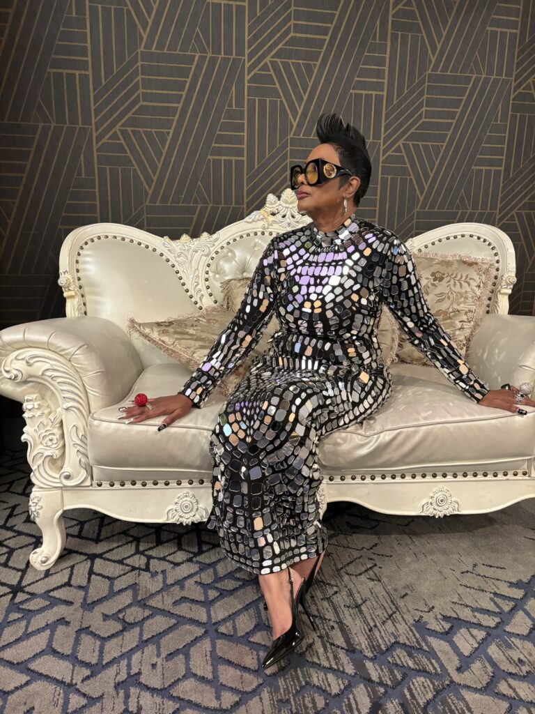 An African American Woman Sitting In The Couch