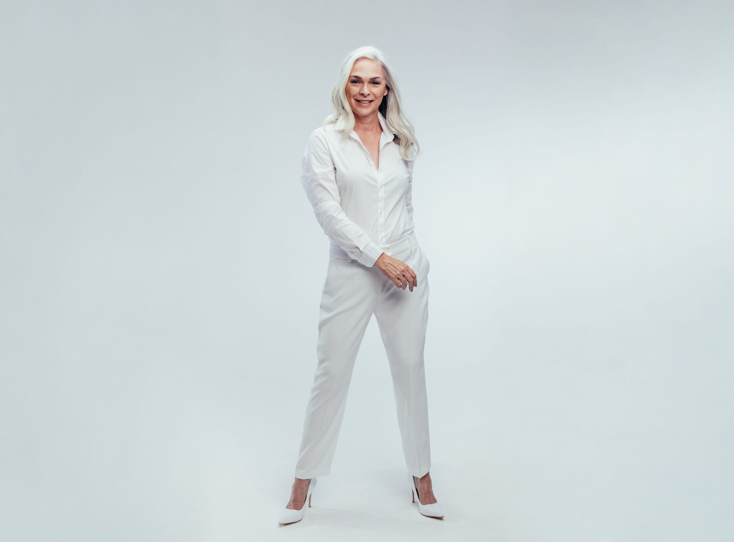 Beautiful Senior Woman Posing In White Casuals